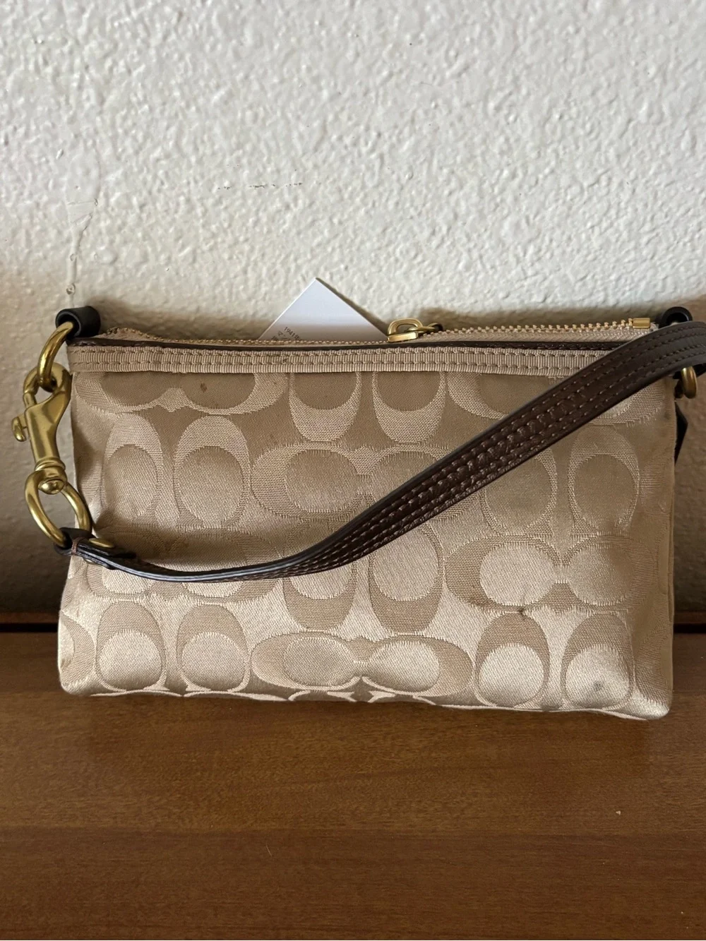 Coach Beige Signature Wristlet Pouch with Gold Logo Plaque